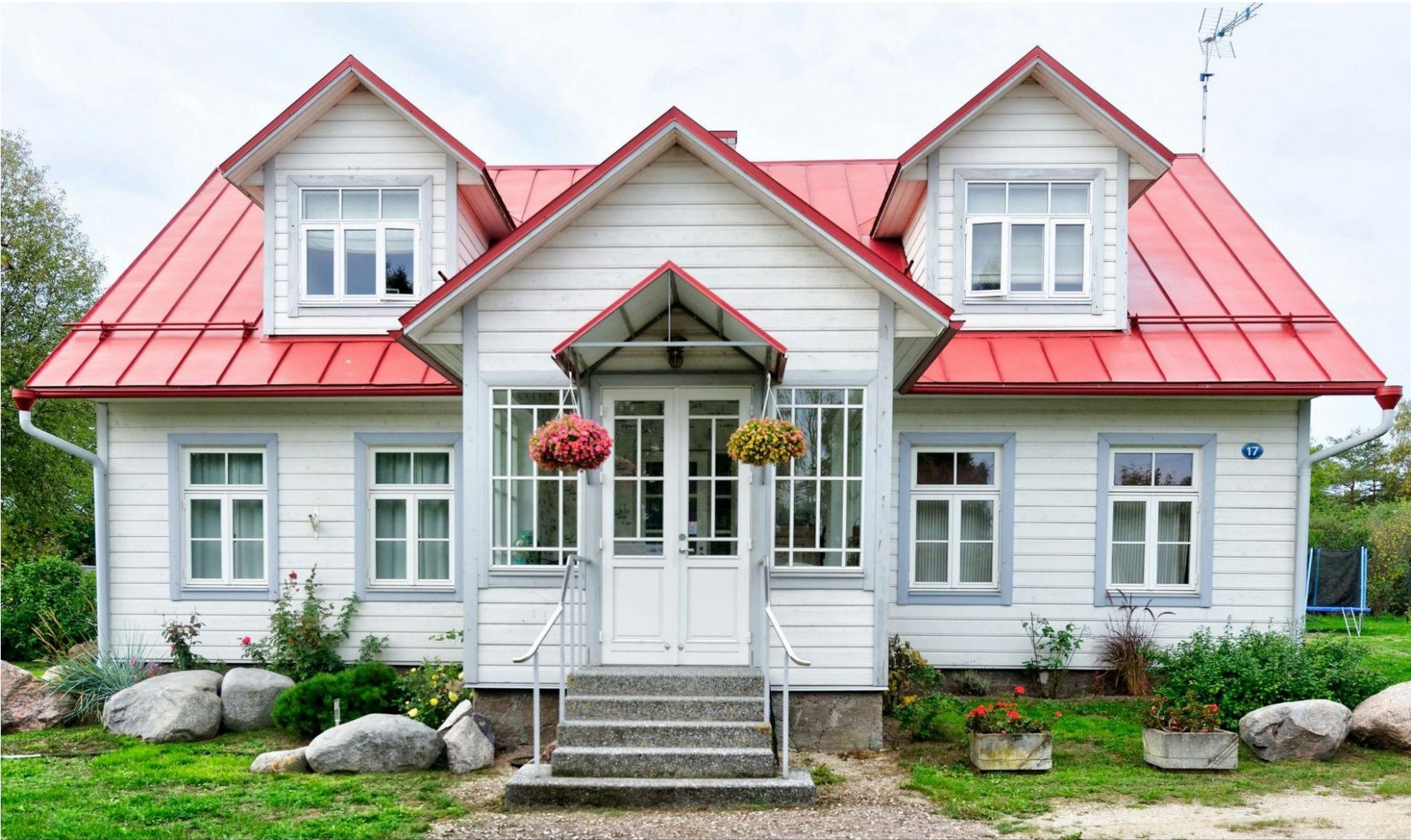 A white house with a red roof